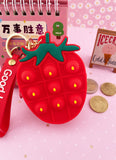 PORTE MONNAIES FRAISE POP IT